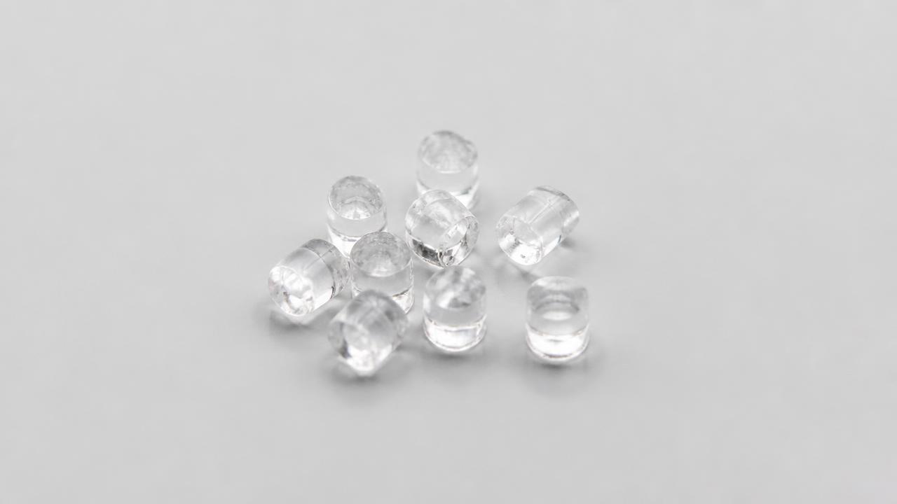 Transparent polycarbonate pellets illustrating the LEXAN™ material family